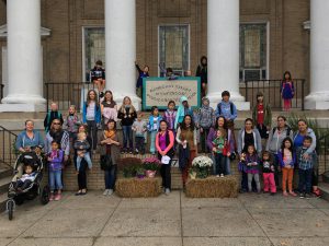 parents and students in front of school buildng